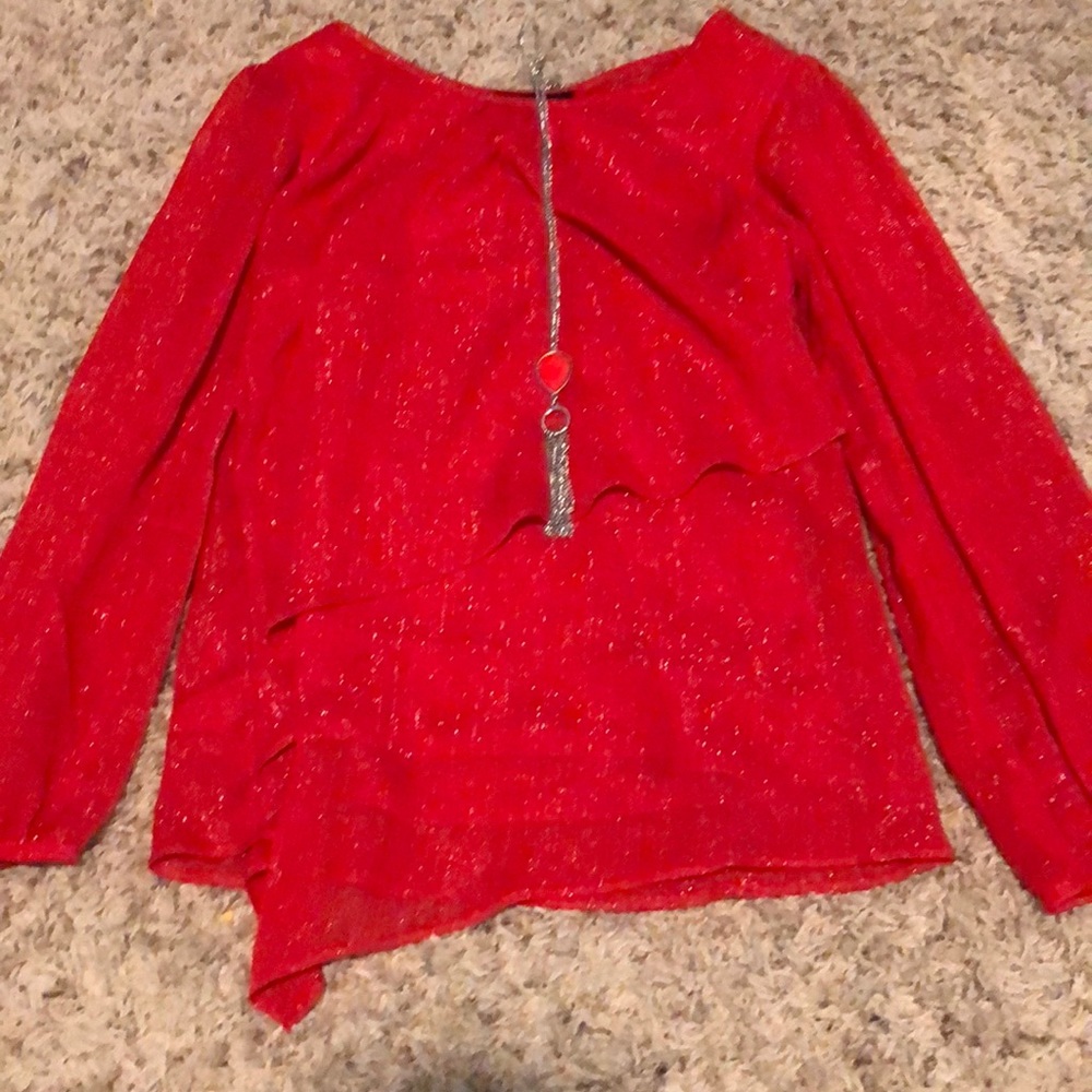 Shiny, red blouse with necklace
